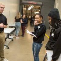 high school students interacting with a presenter